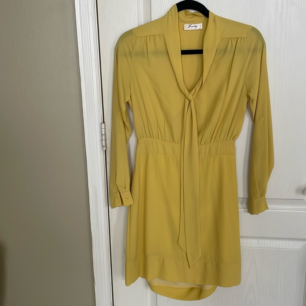 Size small, yellow open back dress. It has a small stain on the back.